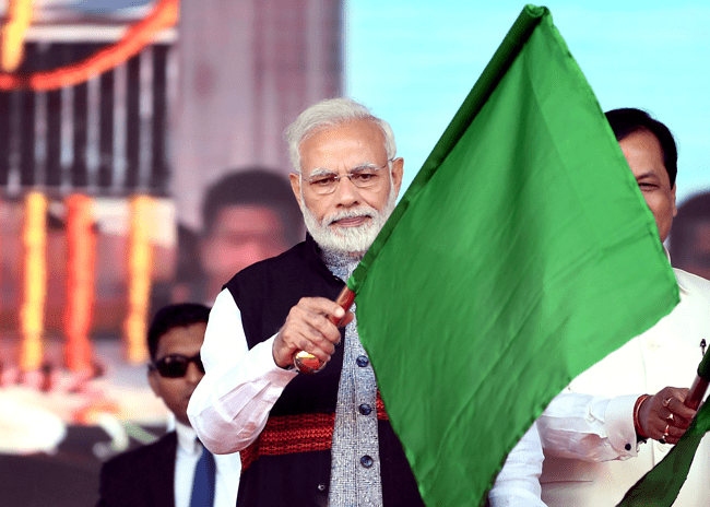 Narendra Modi flagging off first passenger train on the Bogibeel Bridge